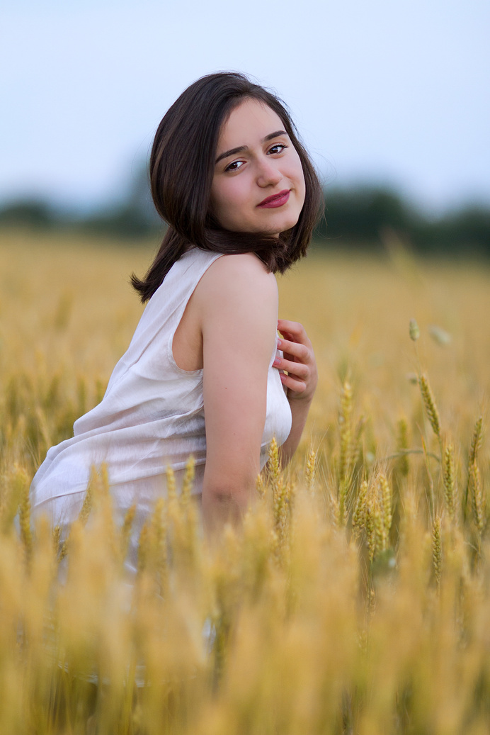Beautiful Woman in Yellow Field
